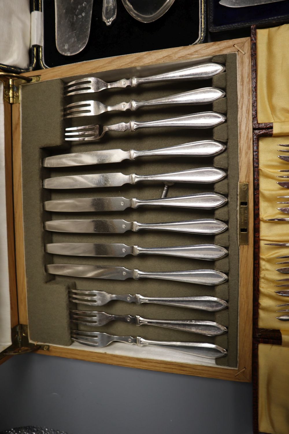 Five cases of plated cutlery.